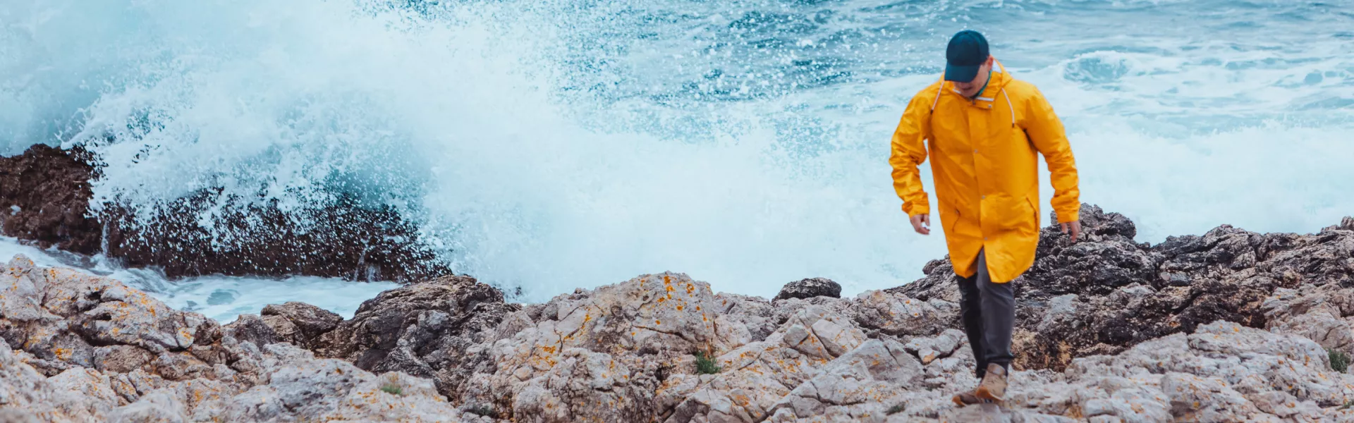 yellow raincoat sea